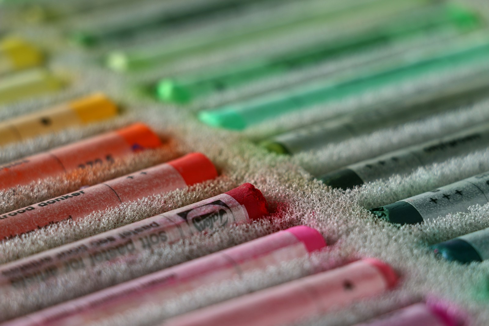 a group of crayons lined up in a row